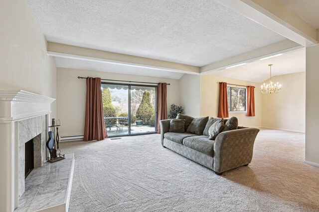 carpeted living room featuring a notable chandelier, a premium fireplace, a baseboard radiator, and a textured ceiling