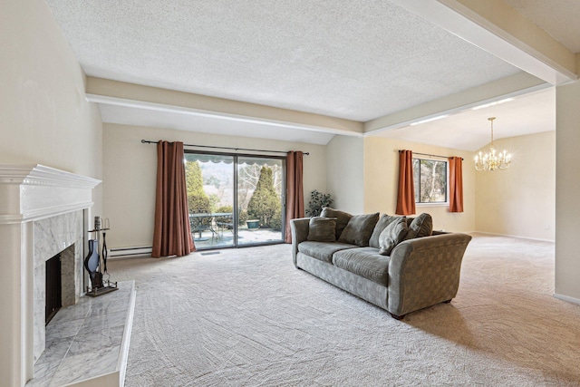 living room with beamed ceiling, a chandelier, a baseboard heating unit, a premium fireplace, and light carpet