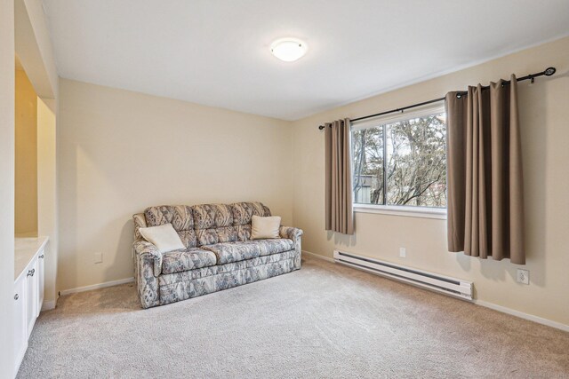 living area featuring a baseboard radiator and light carpet