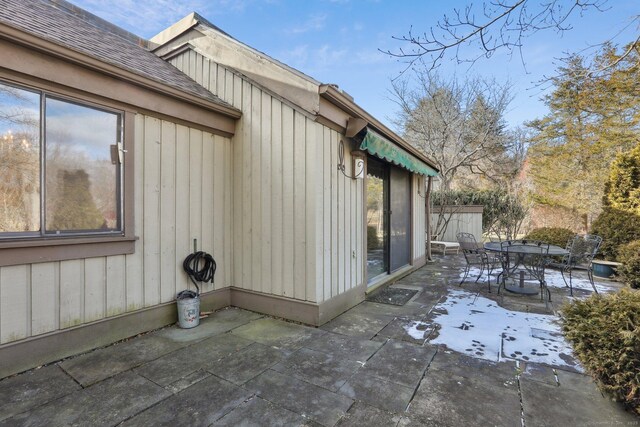 view of side of home featuring a patio area