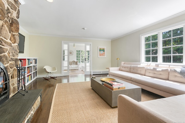 living room featuring ornamental molding, french doors, hardwood / wood-style floors, and a baseboard heating unit