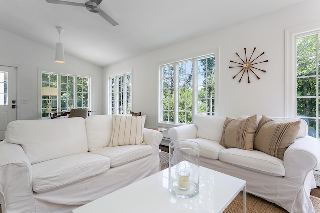 living room with ceiling fan and vaulted ceiling