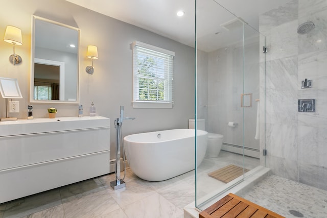 full bathroom featuring toilet, vanity, a baseboard heating unit, and separate shower and tub