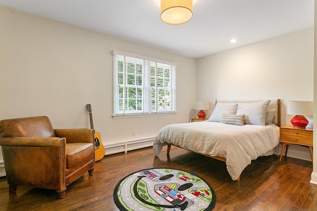 bedroom featuring dark wood-type flooring and a baseboard radiator