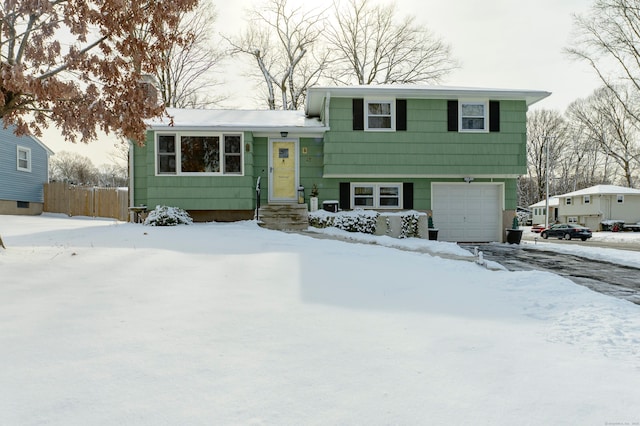 split level home featuring a garage