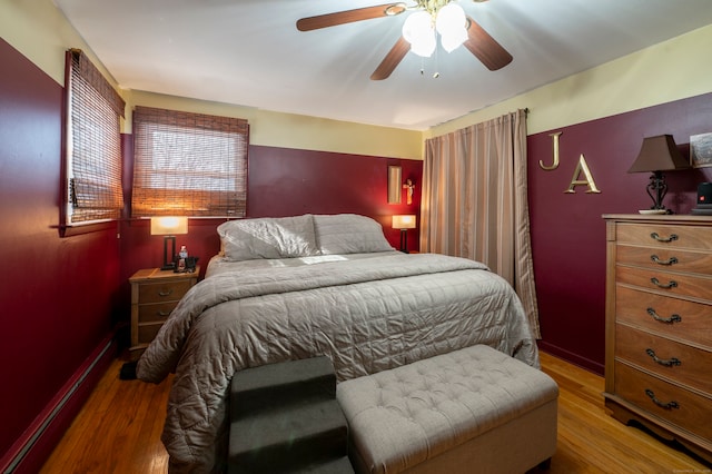 bedroom with hardwood / wood-style flooring and ceiling fan