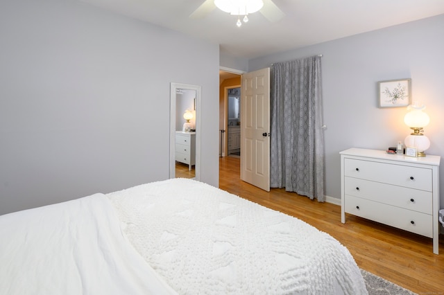 bedroom with light hardwood / wood-style flooring and ceiling fan