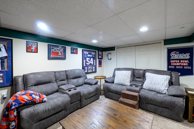 living room with a paneled ceiling