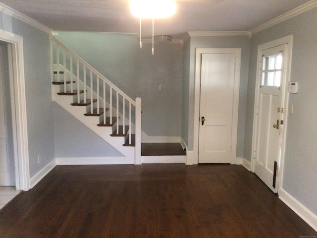 entrance foyer featuring ornamental molding and hardwood / wood-style floors