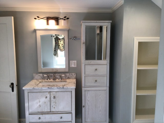 bathroom with vanity and crown molding