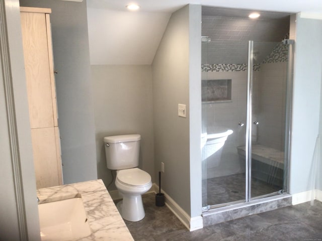 full bath featuring a stall shower, baseboards, toilet, vaulted ceiling, and vanity