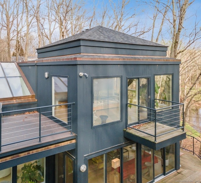 view of side of property featuring a balcony