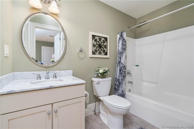 full bathroom featuring tile patterned floors, toilet, vanity, and shower / bath combo