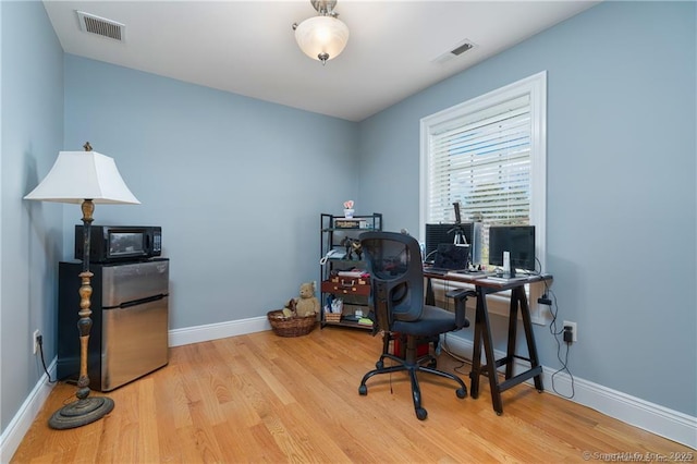 home office featuring light wood-type flooring