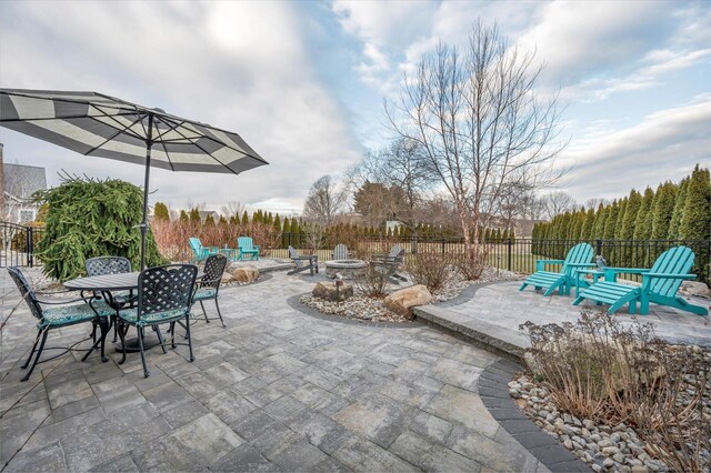 view of patio / terrace with an outdoor fire pit