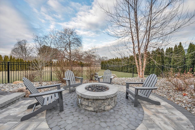 view of patio / terrace featuring an outdoor fire pit