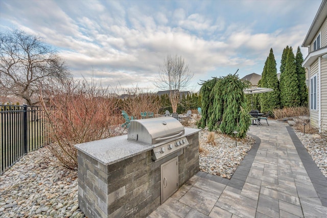 view of patio featuring area for grilling and exterior kitchen