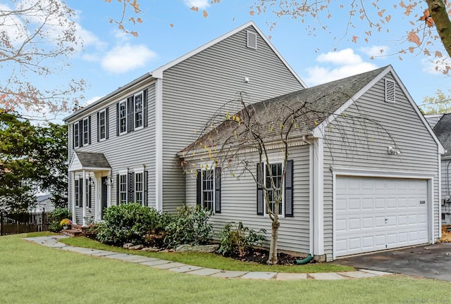 view of side of property with a lawn