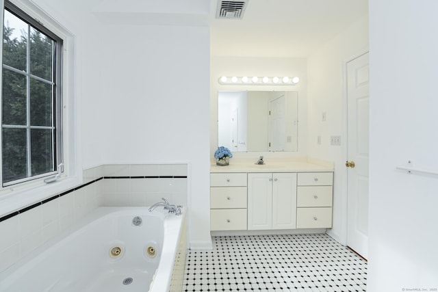 bathroom with vanity and a bathing tub