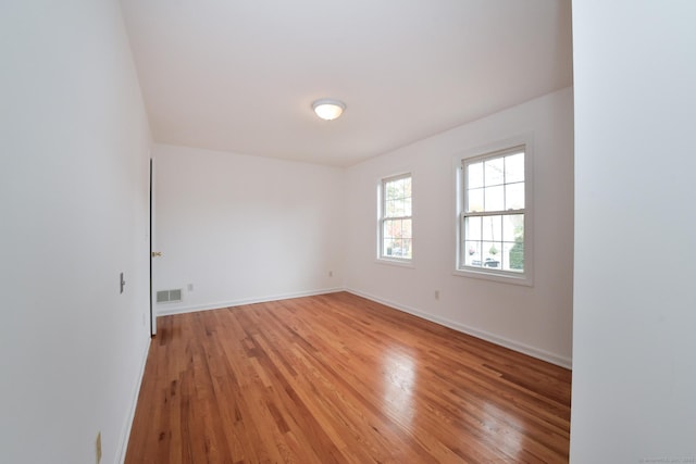 empty room featuring hardwood / wood-style flooring