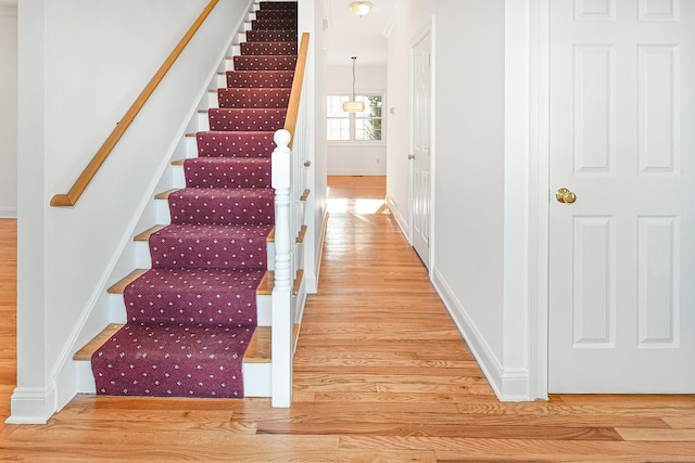 staircase featuring hardwood / wood-style floors