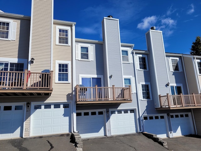 rear view of property featuring a balcony