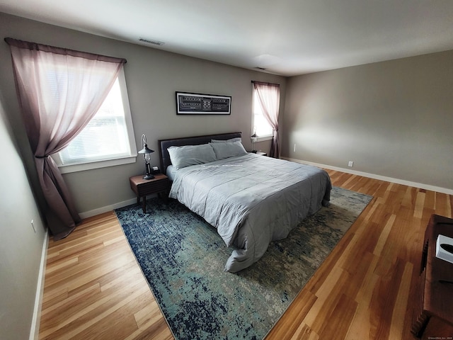 bedroom featuring wood-type flooring