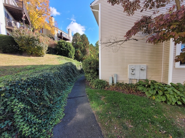 view of side of property featuring a yard