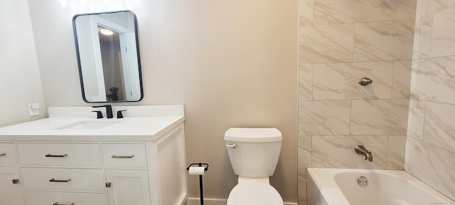 full bathroom featuring toilet, tiled shower / bath, and vanity