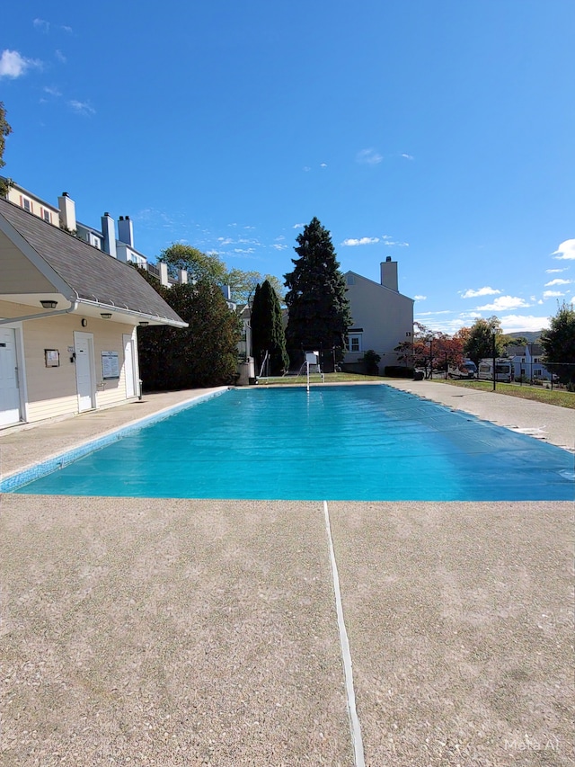 view of swimming pool with a patio area