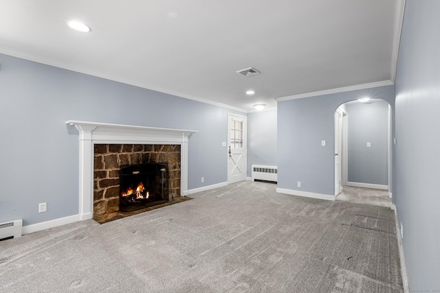 unfurnished living room featuring a fireplace, ornamental molding, radiator, and light carpet