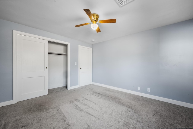 unfurnished bedroom with a closet, ceiling fan, and carpet