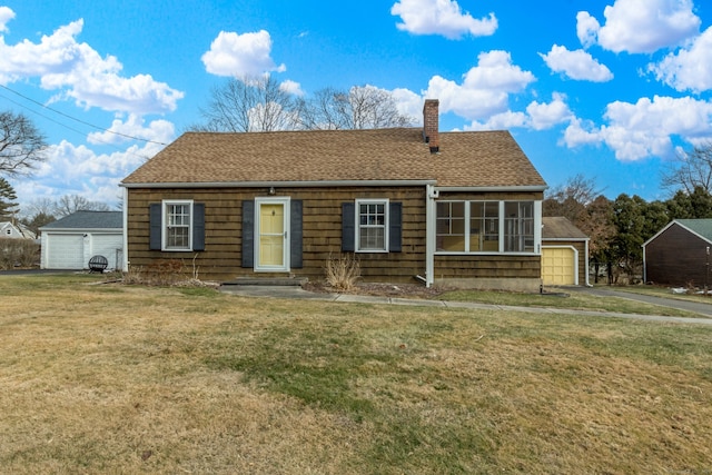 view of front facade featuring a garage and a front lawn