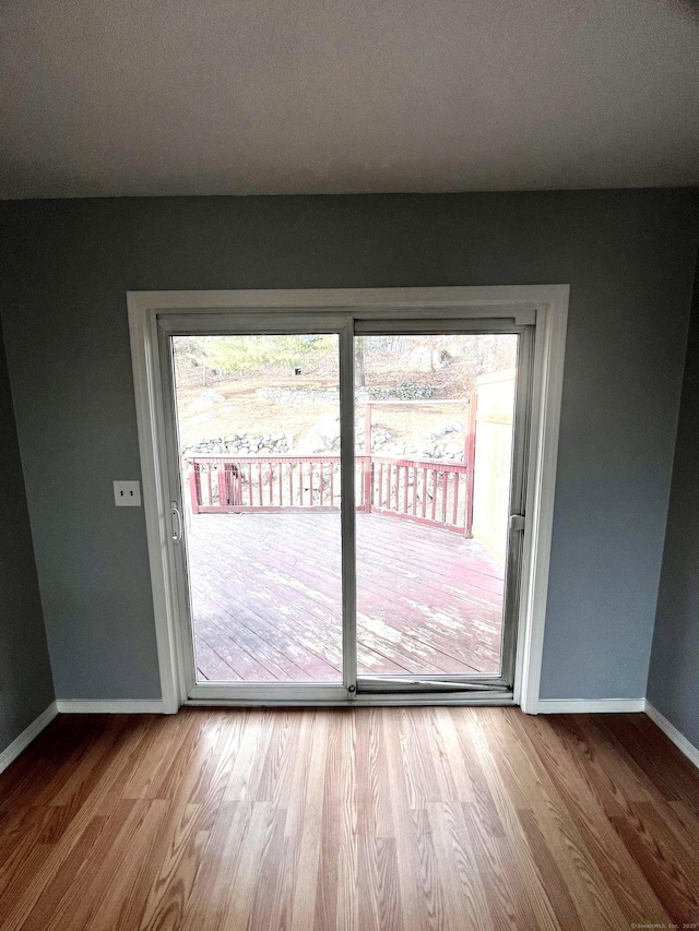 doorway to outside featuring hardwood / wood-style flooring