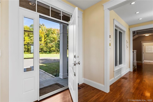 foyer with dark hardwood / wood-style floors