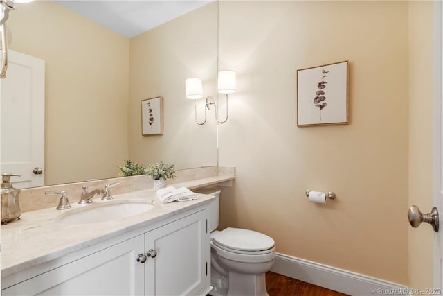 bathroom with toilet and vanity