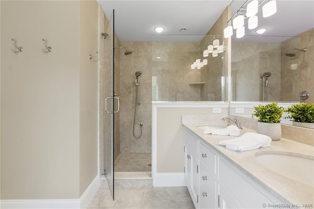 bathroom featuring walk in shower, vanity, and tile patterned flooring