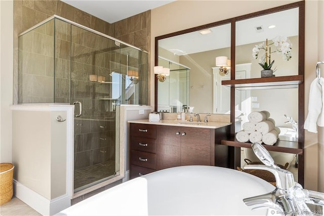 bathroom featuring vanity and shower with separate bathtub