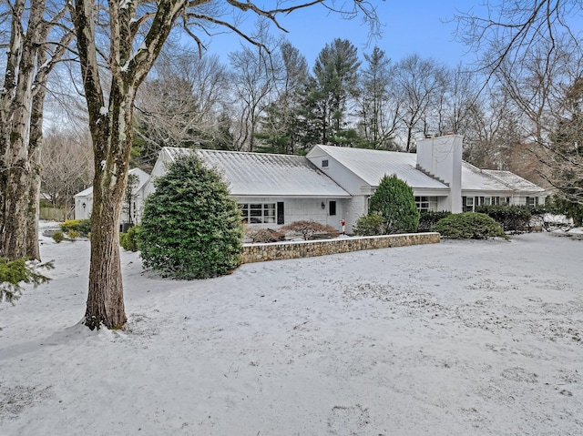 view of snow covered property