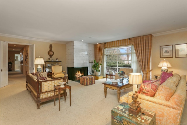 living room with crown molding, a fireplace, and carpet flooring