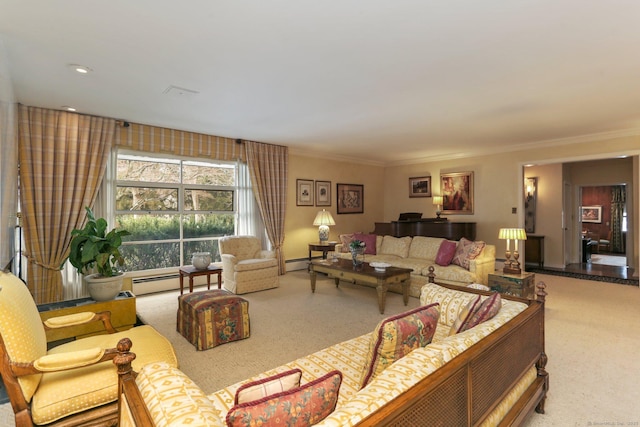 living room with ornamental molding, carpet, and a baseboard heating unit