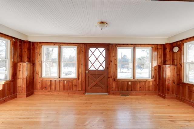 unfurnished sunroom featuring a healthy amount of sunlight