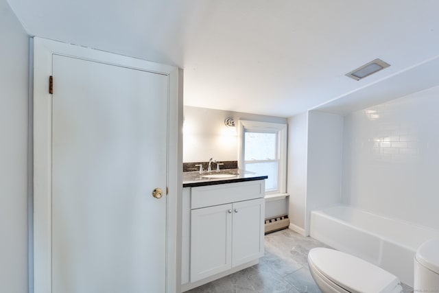 bathroom featuring vanity, a baseboard radiator, and toilet