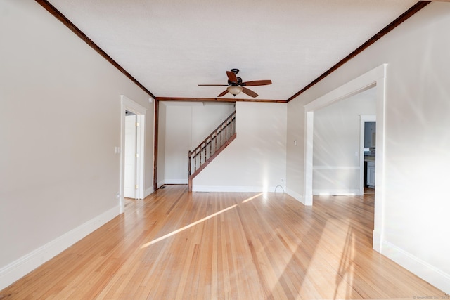 interior space featuring crown molding, hardwood / wood-style floors, and ceiling fan