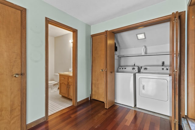 laundry room featuring dark wood-type flooring and independent washer and dryer