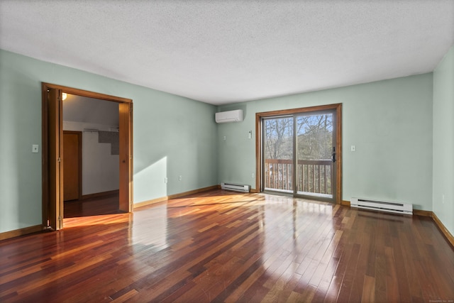 empty room featuring dark hardwood / wood-style flooring, a wall mounted AC, a textured ceiling, and baseboard heating