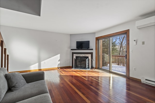 living room with wood-type flooring, a wall mounted air conditioner, a high end fireplace, and a baseboard radiator