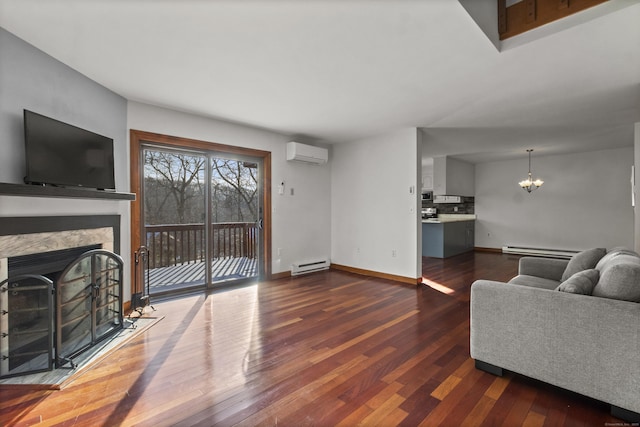 living room featuring a baseboard radiator, a wall mounted air conditioner, a fireplace, and a chandelier