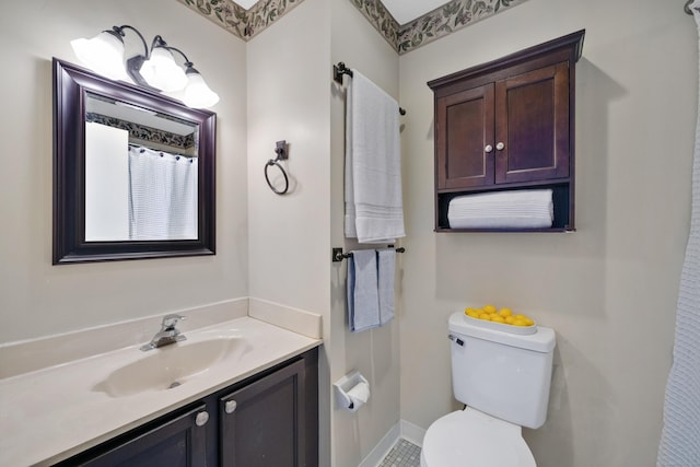 bathroom featuring vanity and toilet