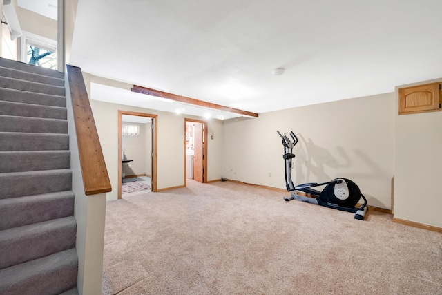 workout area featuring light colored carpet